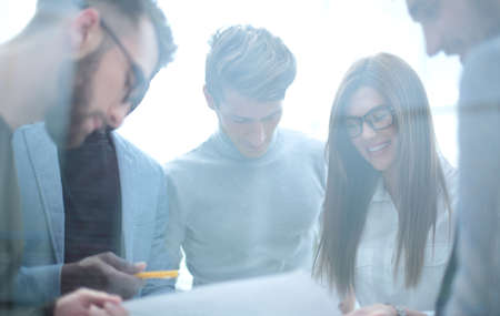 close up.employees discussing business document