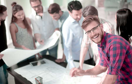 young architect on the background of the design Bureau