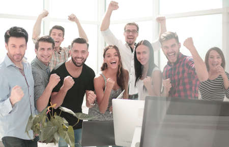 happy business team standing in modern office