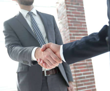 business leader shaking hands with partner.の写真素材