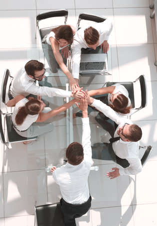 top view.employees of the company connecting the palms togetherの写真素材
