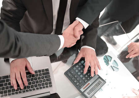 closeup, businessman handshaking after conference.