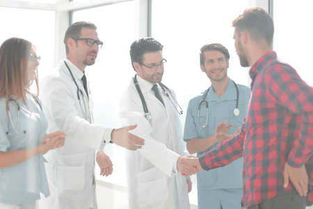 doctors congratulating the patient on recoveryの写真素材