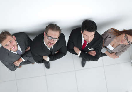 top view.smiling business team looking at the cameraの写真素材