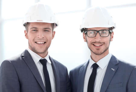 two builders are looking into the camera. concept of constructionの写真素材