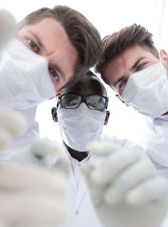 close up.a group of scientists considering control samplesの写真素材