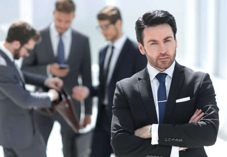 confident businessman standing in the officeの写真素材