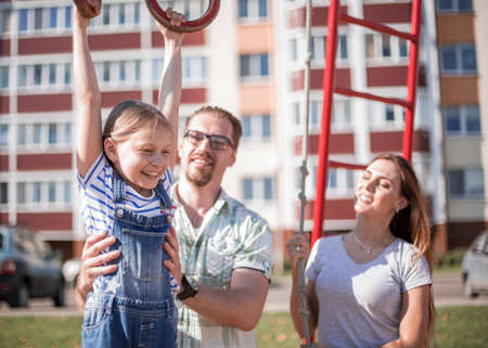 young family in the yard of a new houseの写真素材