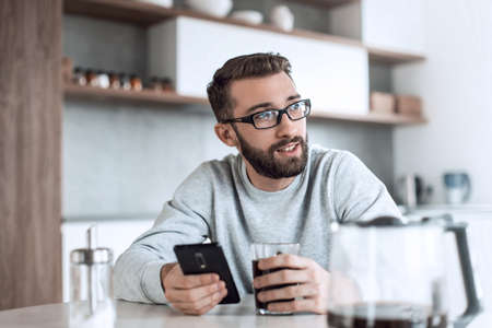 close up. man reading e-mails during Breakfast