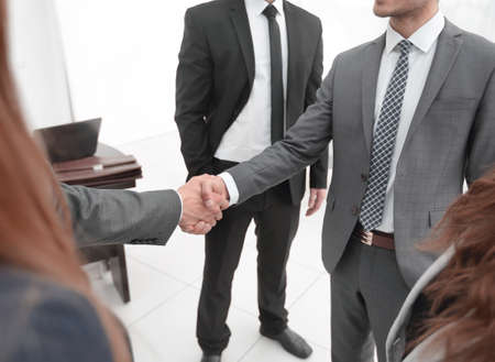 Business shaking hands in the officeの写真素材