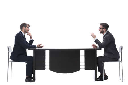 two business people discussing something sitting at the tableの写真素材