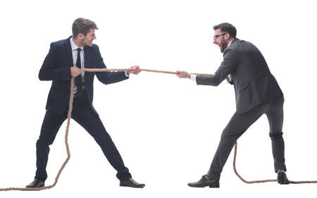 full length . two smiling businessmen pulling the rope.