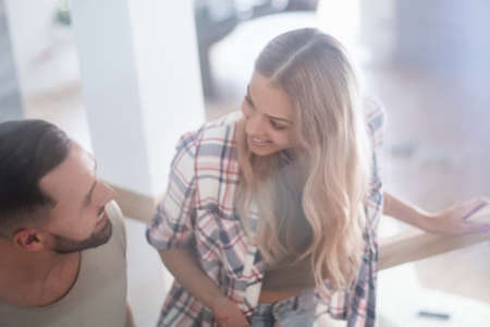 young couple climbed the stairs to their new apartmentの写真素材