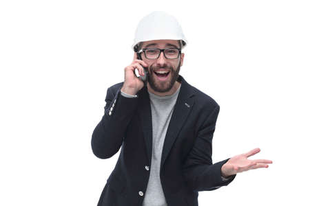 male architect talking on mobile phone . isolated on white