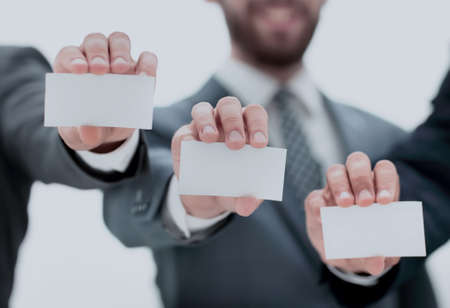 business people showing their business cardsの写真素材