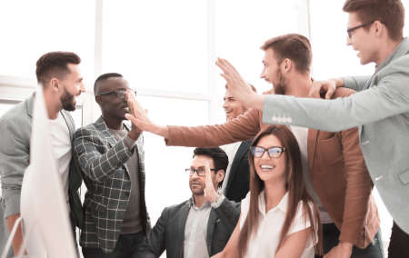 happy business team showing its success