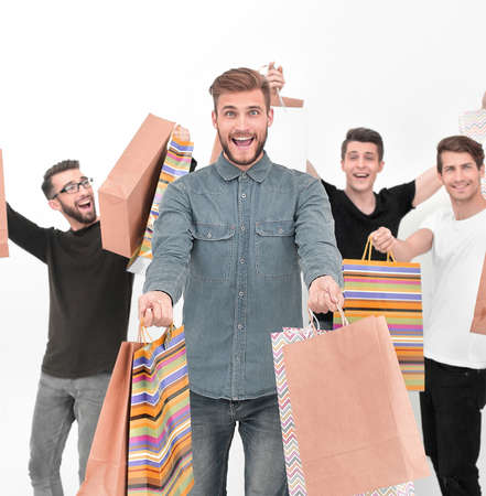 group of cheerful young people with shopping bagsの写真素材