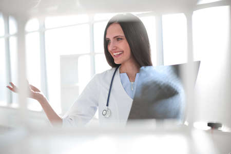 close up. smiling female therapist discussing x-ray