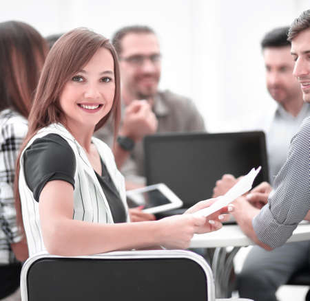 close up.young employee with business team discussing financial documents