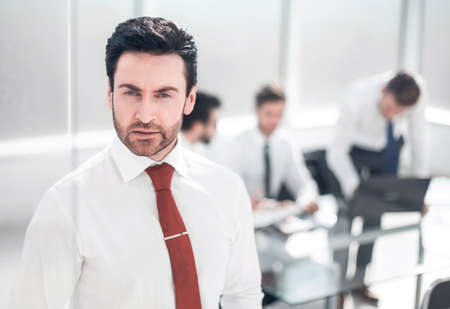 close up.serious businessman standing in the office.の写真素材