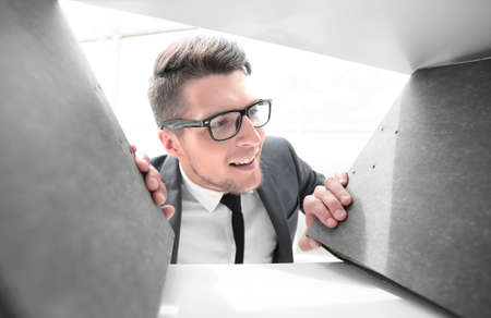 smiling engineer selects documents