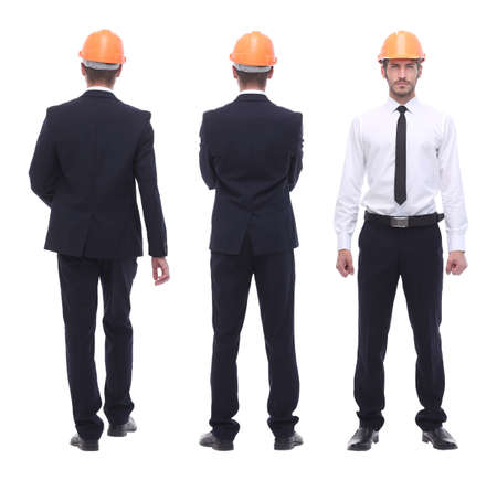 in full growth .a qualified architect in an orange helmetの写真素材