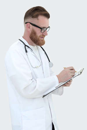 medical doctor writes a medical report. isolated on whiteの写真素材