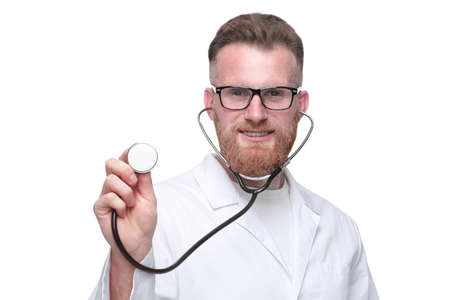 friendly doctor showing his stethoscope . isolated on whiteの写真素材