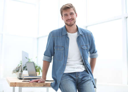 successful young entrepreneur standing in the officeの写真素材