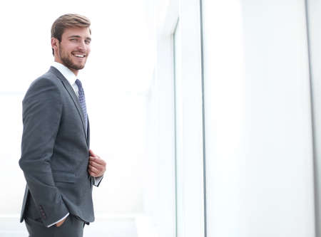 close up. focused young businessman standing in office