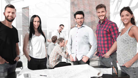 group of designers standing in a modern officeの写真素材