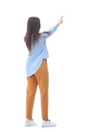 young woman pointing at blank screen .isolated on whiteの写真素材