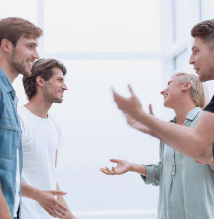 happy coworkers hugging each other when meetingの写真素材