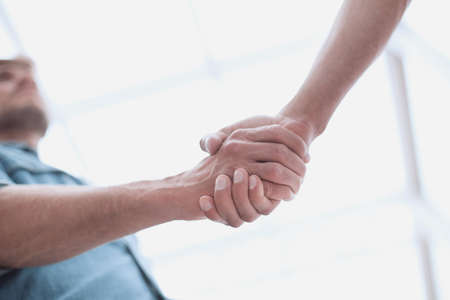 business men shaking hands in the office lobby
