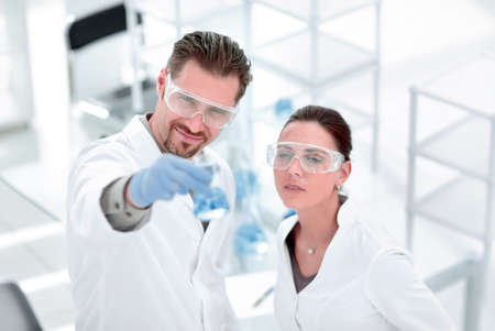 scientist and assistant look at the results of their researchの写真素材