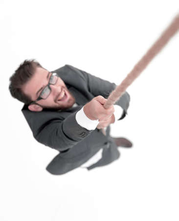 successful businessman climbing the rope