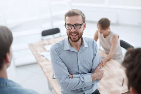 close up.young employee discussing his ideas with colleagues