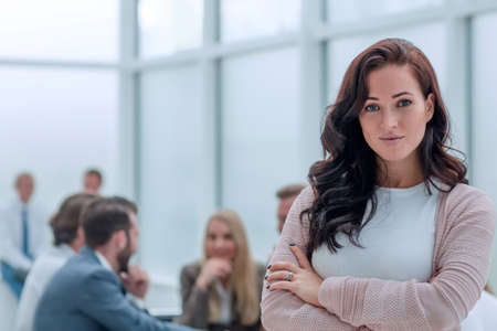 confident young business woman on the background of the office.