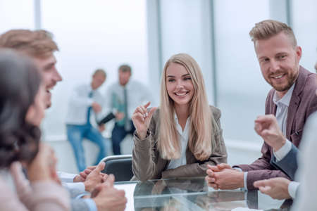 young business woman discusses her ideas with a business team.
