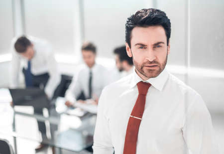 close up.serious businessman standing in the office.の写真素材