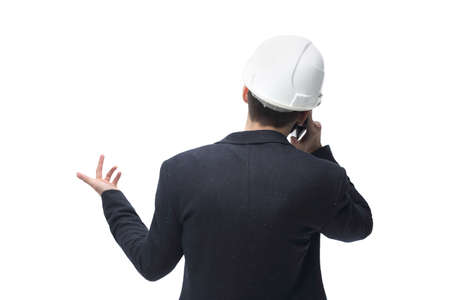 rear view. businessman architect talking on mobile phone