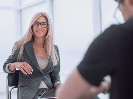 man and woman sitting in Studio during podcast interviewの写真素材