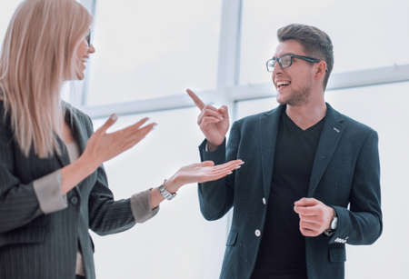 business couple discussing something standing in the office