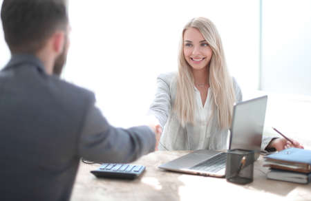 successful businesswoman shaking hands with her business partnerの写真素材