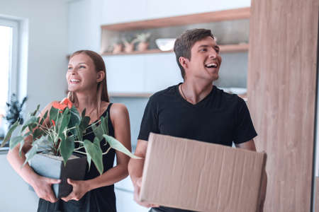 young family standing in their new apartment