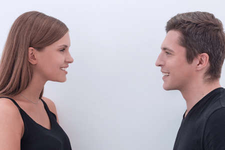 close up. smiling man and woman looking at each other.