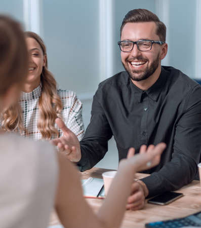business team discussing business issues over a Cup of coffeeの写真素材