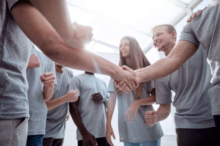 handshake of young people in a circle of friendsの写真素材