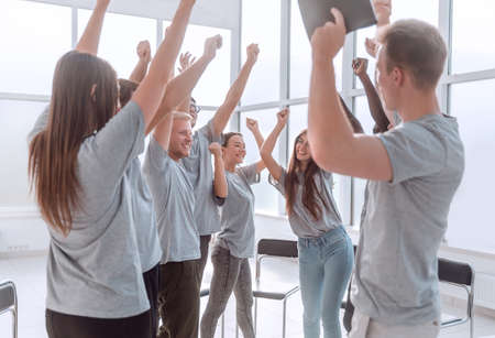 happy group of young people standing in the conference room