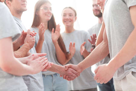 handshake of members of the contact group, to applause